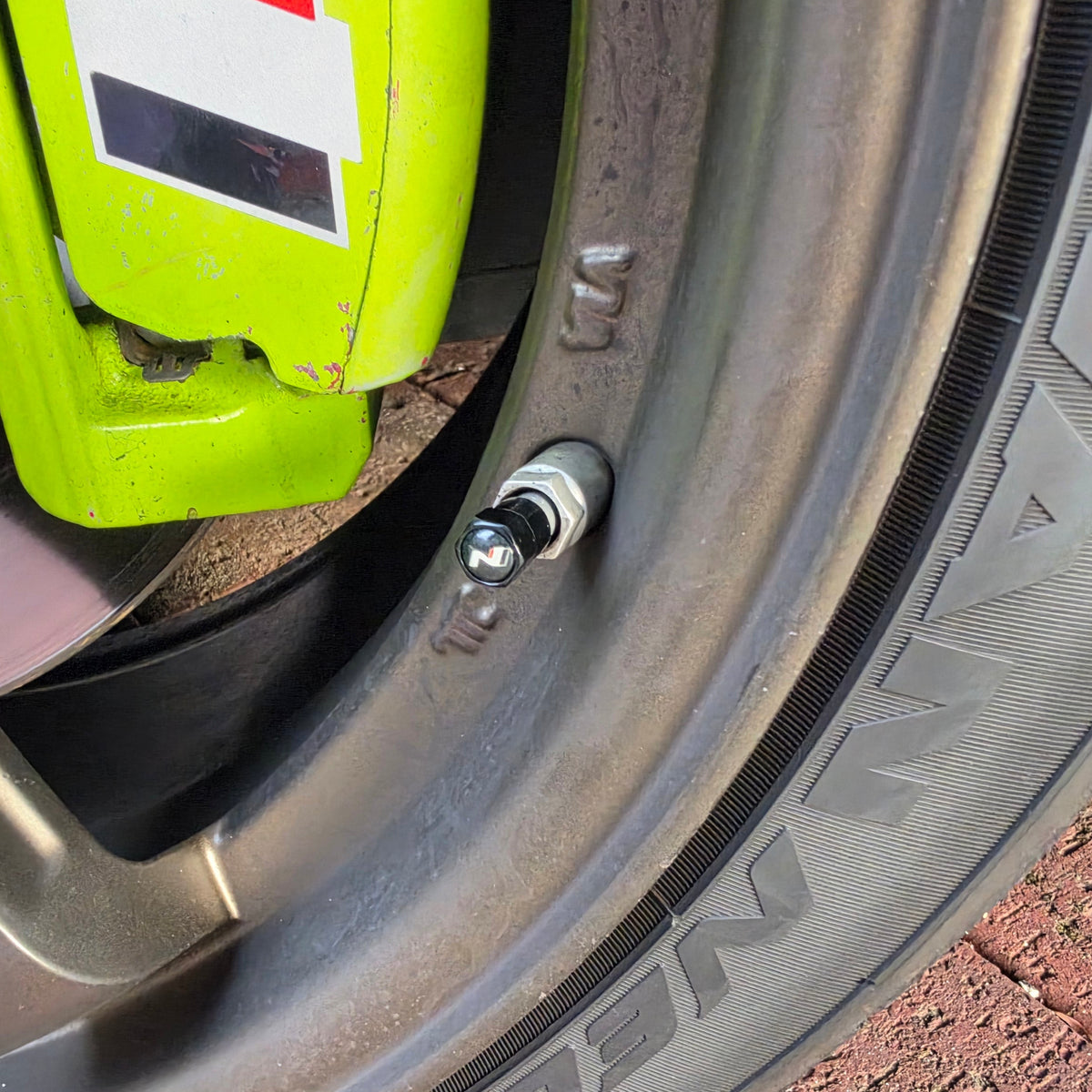 Black Radecals N logo valve cap fitted to a Hyundai N wheel