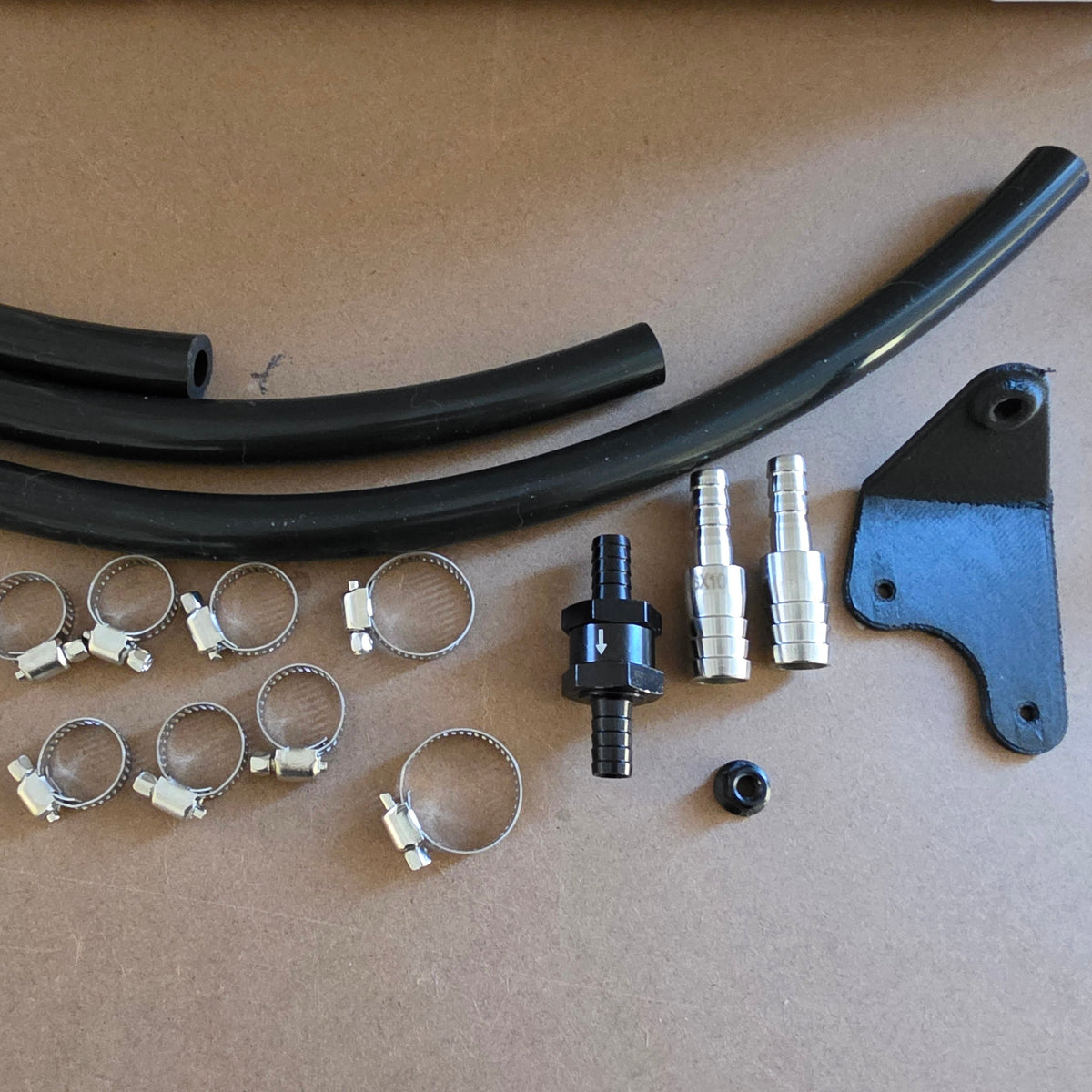 i20N catch can kit contents: hoses, hose clamps, check valve, 16mm to 10mm reducer fittings and mounting bracket